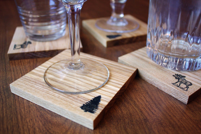 Set of four pine tree and moose wood handcrafted coasters