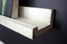 JTWoodworks white distressed ledge style shelf is perfect for organizing small items and displaying pictures or books within your home. It is also great in your office, studio, gallery or studio for displaying products and holding supplies. 